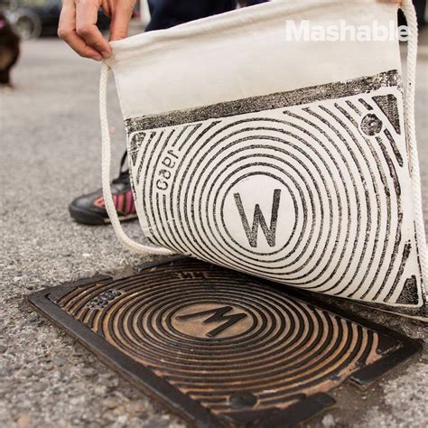 a person is holding a white bag over a manhole cover on the ground with ...