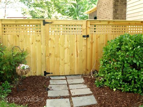 A beautiful fence and gate with an arbor - Simply Swider | Fence design, Wood privacy fence ...