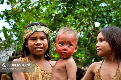 Iquitos, Peru, Amazon Jungle, girls from a Yagua Tribe take care of a ...