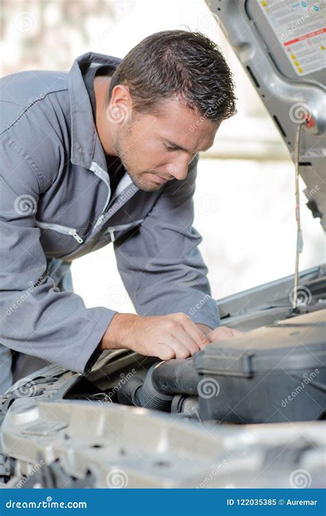 Mechanic Repairing an Engine Stock Image - Image of manual, restore ...