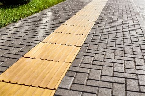 Premium Photo | Tactile paving on pedestrian walkway yellow tactile ...