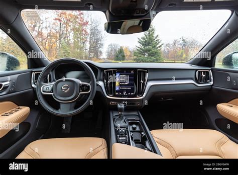 Interior of a new 2020 Volvo car, dressed in black and tan leather ...