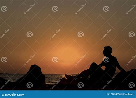 Sad Young Man Silhouette and Sea Stock Photo - Image of sitting ...