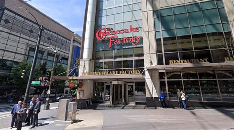 Woman carrying entire Cheesecake Factory cheesecake during Seattle ...