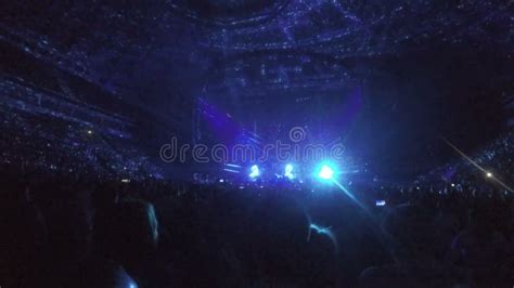 Illumination Flashing on Stage, Silhouettes of Audience Enjoying Rock ...