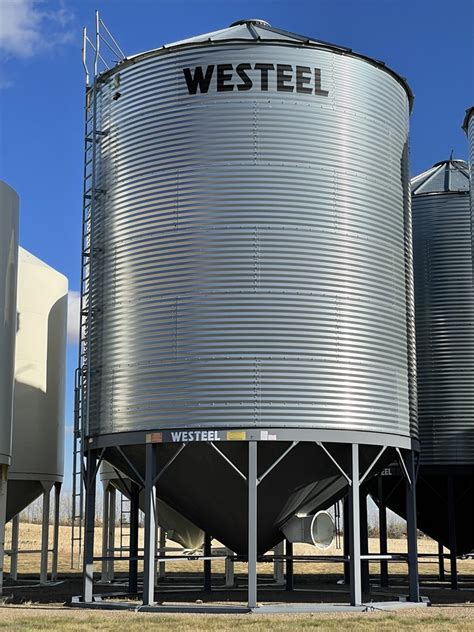 Dunkle Auction Services - WESTEEL ±7700 Bushel Hopper Bottom Grain Bin w/ Triple Skid. Model# 2106.