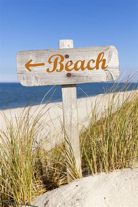 Wooden Beach Directional Sign in the Dunes Stock Photo - Image of ocean ...