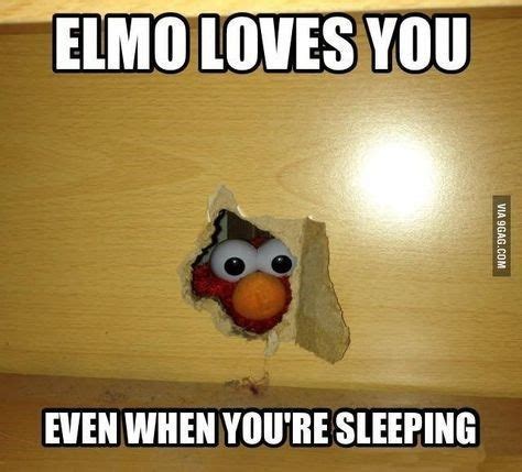 an angry bird pokes its head out of a hole in a wooden wall that says, elmo loves you even when ...