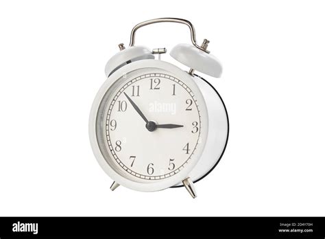 White vintage alarm clock on white background isolated Stock Photo - Alamy