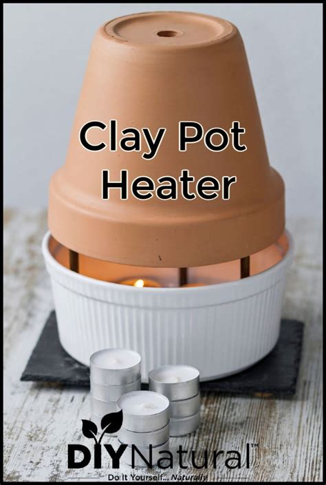 clay pot heater sitting on top of a wooden table