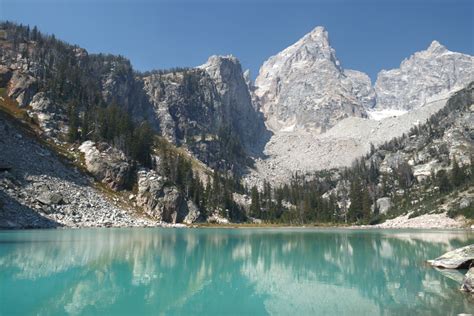 The Reflection of the World in the Grand Tetons - SquirrelSarah