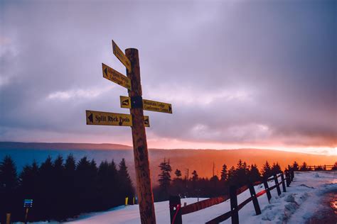 Signage on Road Filled With Snow · Free Stock Photo