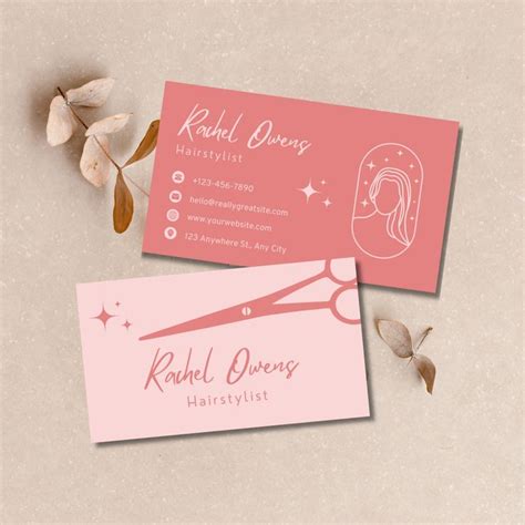 two business cards on top of each other with scissors and hair stylist's logo