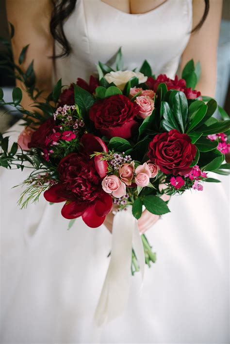 Red peony bouquet for a Calgary wedding at @bvrrestaurant Photographed ...