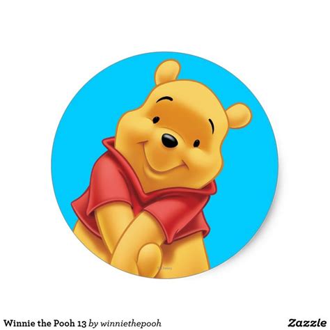 a cartoon winnie the pooh sitting on top of a blue circle