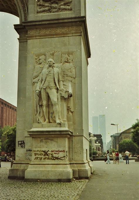 Graffiti on Washington Square Park Arch with World Trade Center in background - Village Preservation