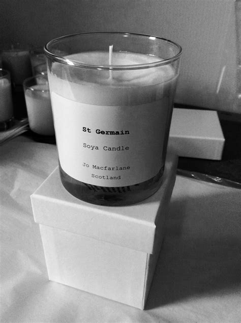 a candle sitting on top of a white box