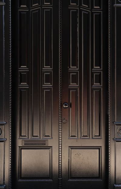 Premium Photo | Fragment of black wooden door texture