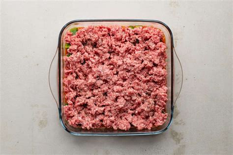ground beef in a casserole dish ready to be cooked