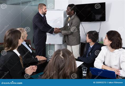 Two Businessmen Shaking Hands As Sign of Closing Deal Stock Image ...