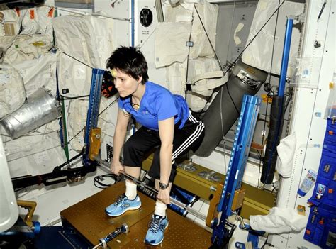 An astronaut performing dead lift exercises on the Advanced Resistive... | Download Scientific ...