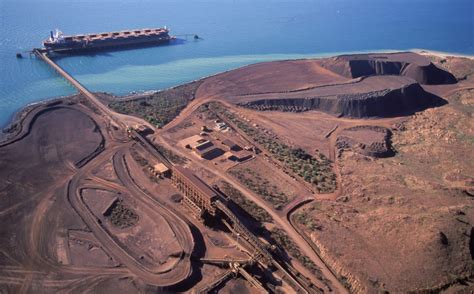 Mining iron oreLoading iron Ore on a ship at Dampier Western Australia ...