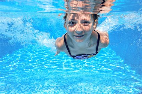 Little Girl Swimming Underwater - Image to u