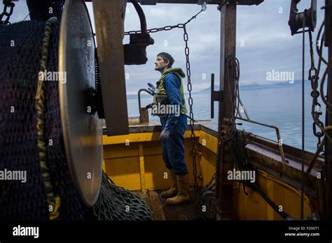 Fisherman preparing trawler Stock Photo - Alamy