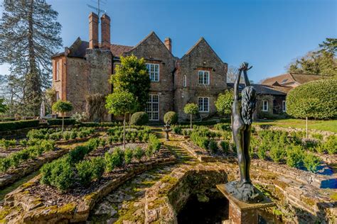 A historic manor house with a lake and four acres of landscaped gardens, nestled in the heart of ...