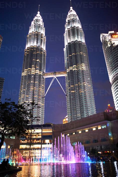 Petronas towers illuminated at night, low angle view, Kuala Lumpur ...