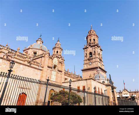 The towers of the Morelia Cathedral against a blue sky, in the Mexican ...