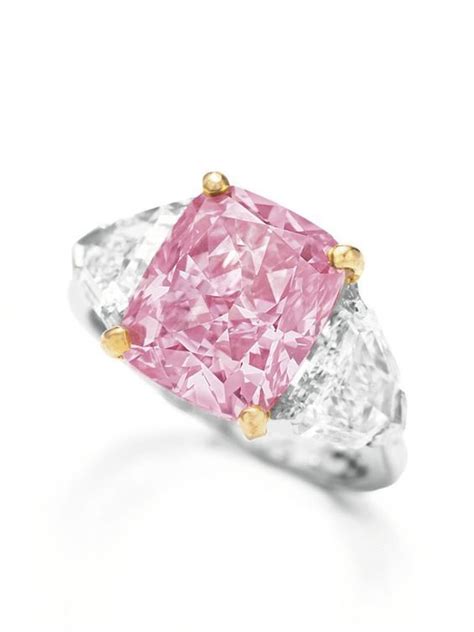 'THE VIVID PINK'. AN EXQUISITE COLOURED DIAMOND AND DIAMOND RING, BY GRAFF. Set with a cushion ...