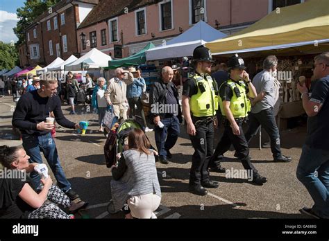 WINCHESTER HAMPSHIRE ENGLAND UK Police officers on foot patrol the market area of Winchester ...