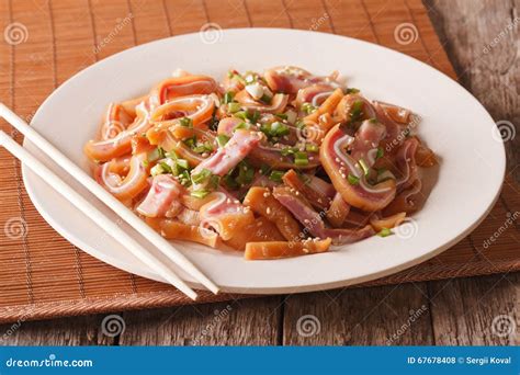 Fried Pig Ears with Sesame Seeds and Green Onions Close-up. Horizontal Stock Photo - Image of ...