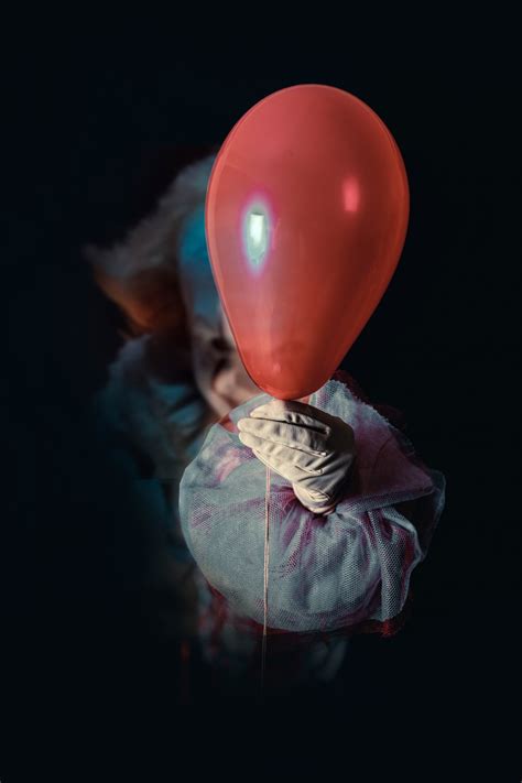 Pennywise holding red balloon in the dark - Free Stock Photo Download ...