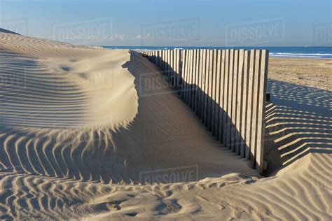 Sand Fence at Beach near Cadiz, Costa De La Luz, Cadiz Province, Andalusia, Spain - Stock Photo ...