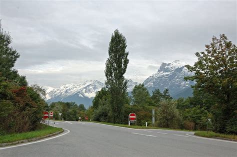 Road in the Mountains of Switzerland Stock Photo - Image of person ...