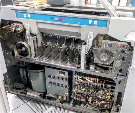 Repairing the card reader for a 1960s mainframe: cams, relays and a clutch