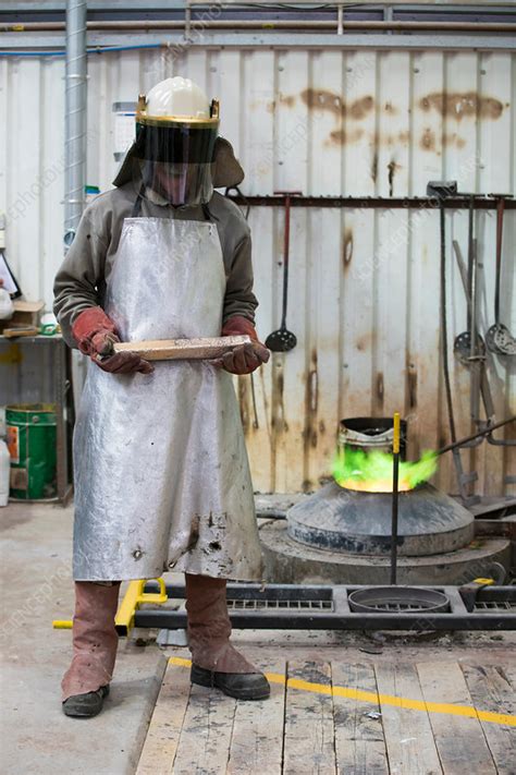 Male foundry worker in bronze foundry - Stock Image - F017/9335 - Science Photo Library