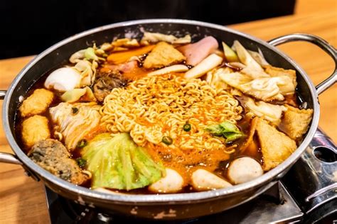 Premium Photo | Korean hot pot 'budae jjigae' is korean fusion food incorporates american style ...