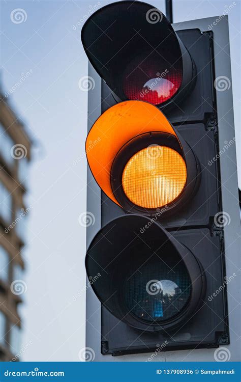 Close Up of an Amber Traffic Light Illuminated Stock Photo - Image of rules, crossing: 137908936