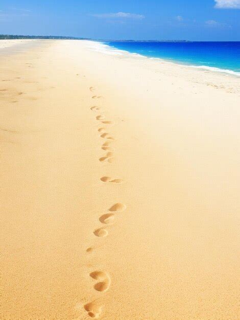 Premium AI Image | footprints on the beach in the sand