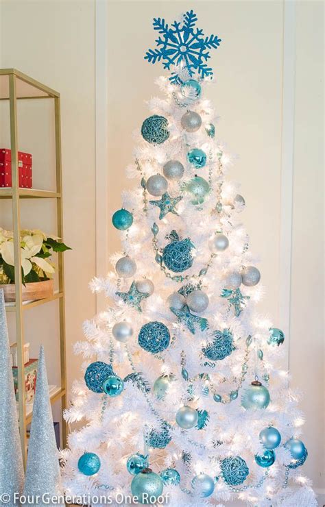 Our cute blue + white Christmas tree | White christmas tree decorations, White christmas trees ...