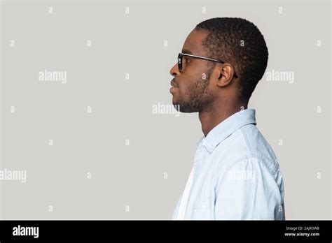 African man isolated on gray background side profile view face Stock Photo - Alamy