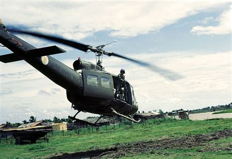 Vietnam War 1967 - A door gunner surveys the area in the M… | Flickr