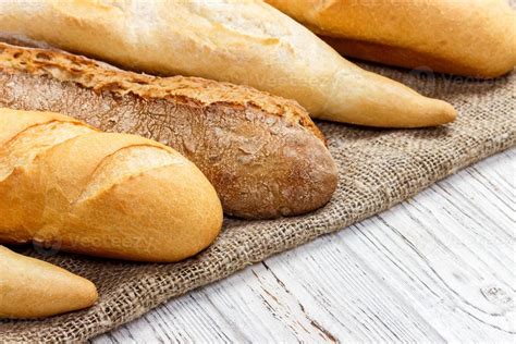 different types of baguette on a wooden background 13624954 Stock Photo ...