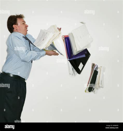 Man dropping files Stock Photo - Alamy