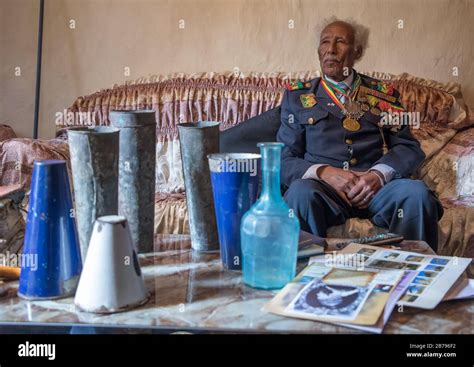 Ethiopian veteran from the italo-ethiopian war in army uniform in his home, Addis Ababa Region ...