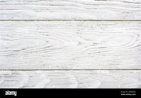 Wood texture background, top view of empty light wooden table. Rustic white rough planks for ...