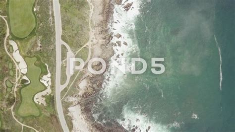 an aerial view of the ocean and golf course